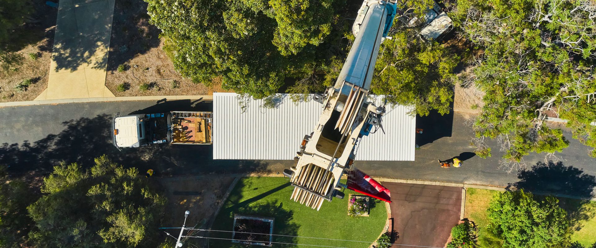 aerial view of fox granny flat being relocated by a crane